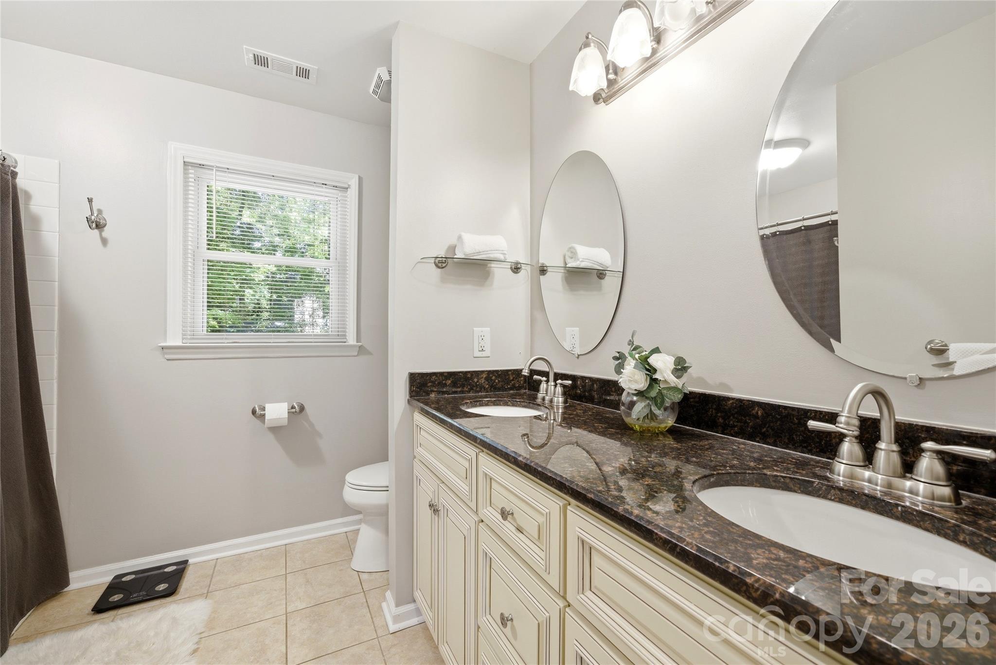 3066 Point Clear Drive Fort Mill, SC 29708 - Photo 21 of 47 a bathroom with a granite countertop double vanity sink and a mirror