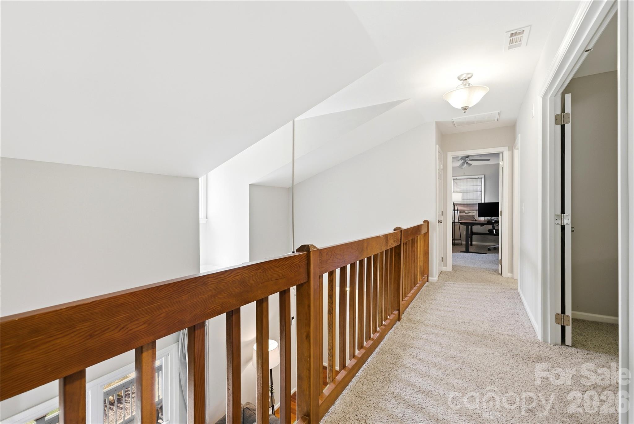 3066 Point Clear Drive Fort Mill, SC 29708 - Photo 28 of 47 a view of a hallway with wooden floor and a bathroom