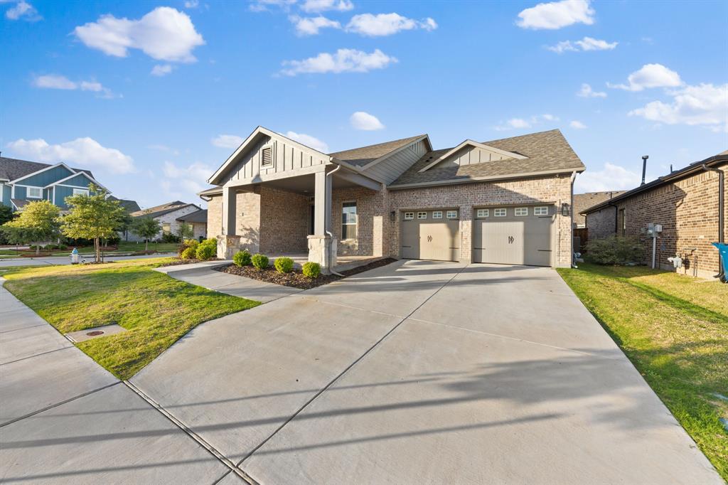 8808 Royal Star Road Rowlett, TX 75089 - Photo 9 of 40 a front view of a house with a yard