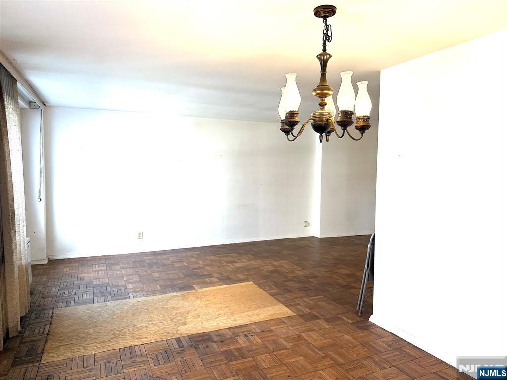 280 South Prospect Avenue, Unit 3N Hackensack, NJ 07601 - Photo 11 of 27 a view of a room with a mirror and a ceiling fan