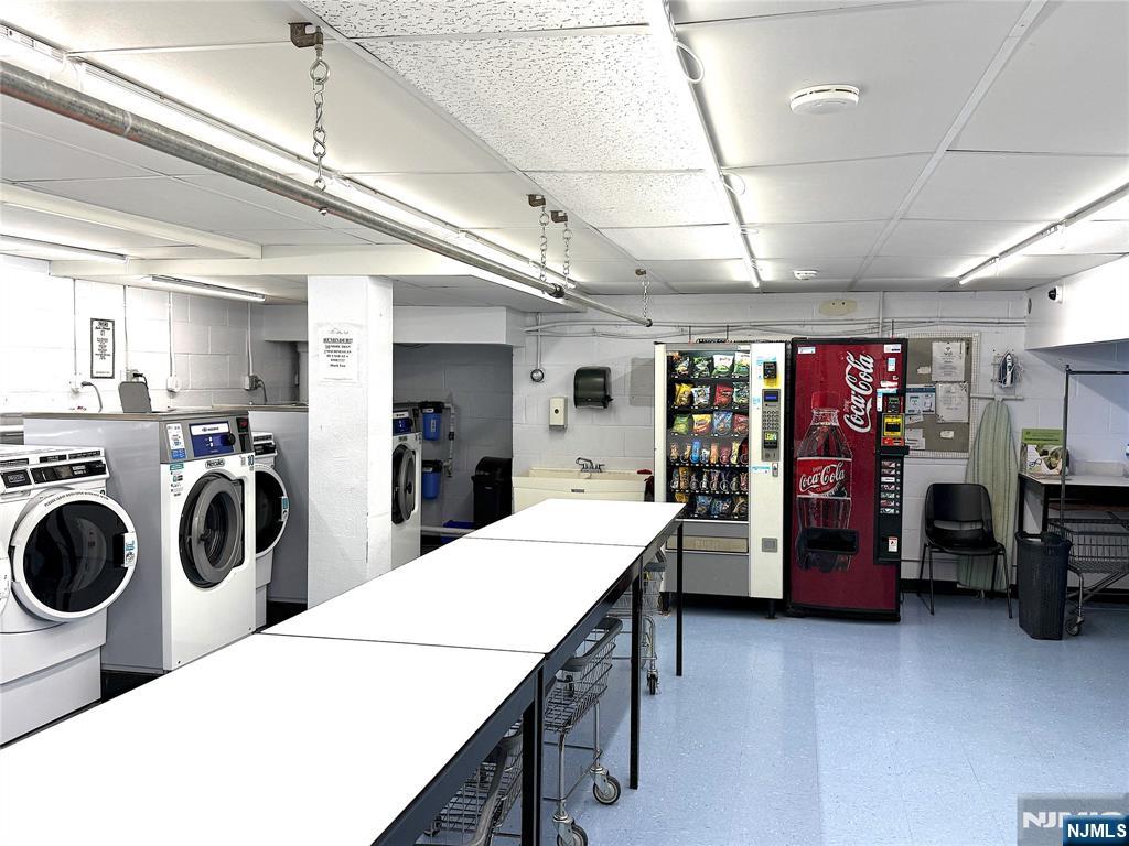280 South Prospect Avenue, Unit 3N Hackensack, NJ 07601 - Photo 24 of 27 a kitchen with a refrigerator and white cabinets