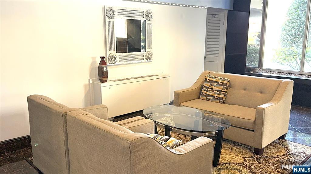 280 South Prospect Avenue, Unit 3N Hackensack, NJ 07601 - Photo 5 of 27 a living room with furniture and a window