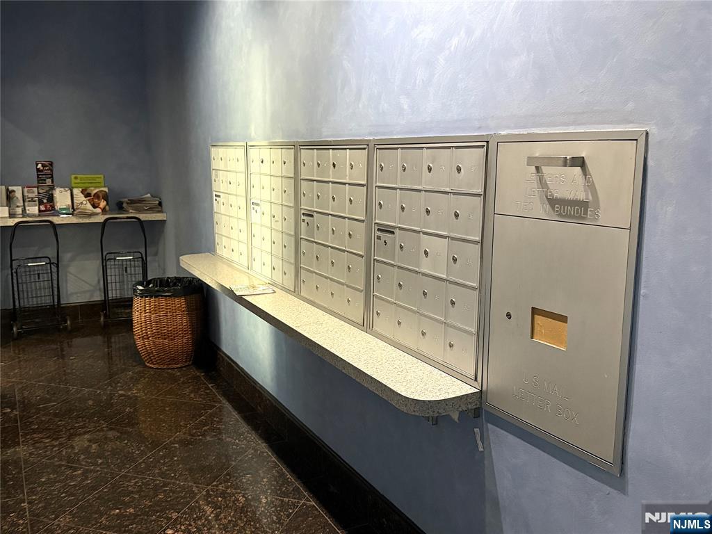 280 South Prospect Avenue, Unit 3N Hackensack, NJ 07601 - Photo 6 of 27 a kitchen with stainless steel appliances granite countertop a sink and cabinets