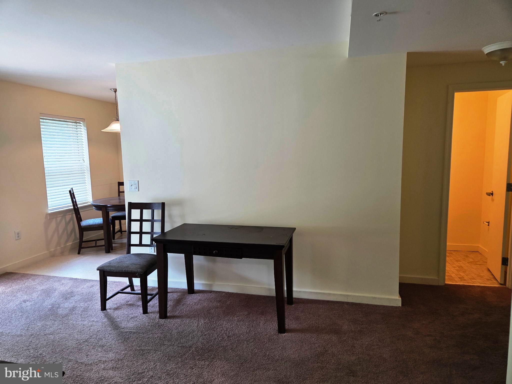1600 Church Road, Unit B301 Wyncote, PA 19095 - Photo 5 of 14 Living room, entrance to powder room on right
