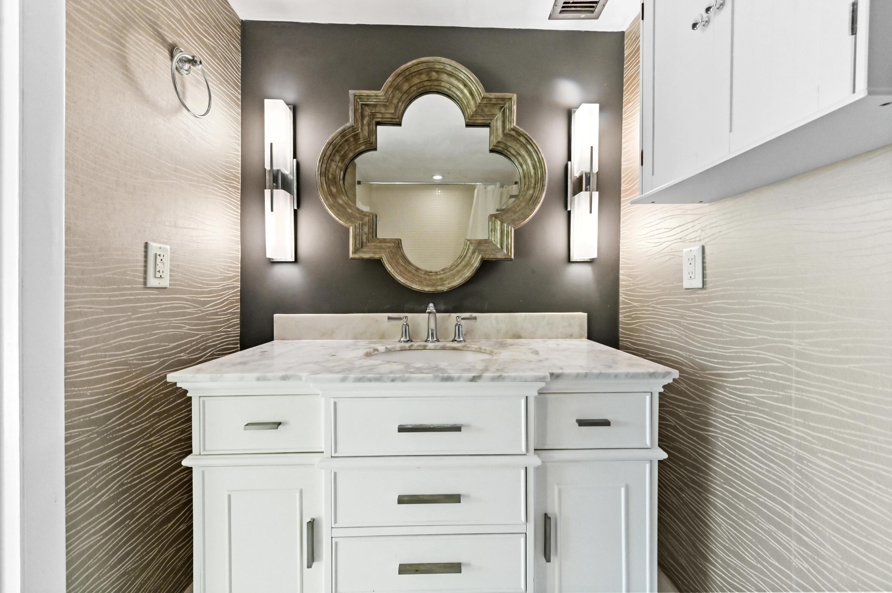 5700 Northwest 2nd Avenue, Unit 503 Boca Raton, FL 33487 - Photo 17 of 37 a bathroom with a sink and a mirror