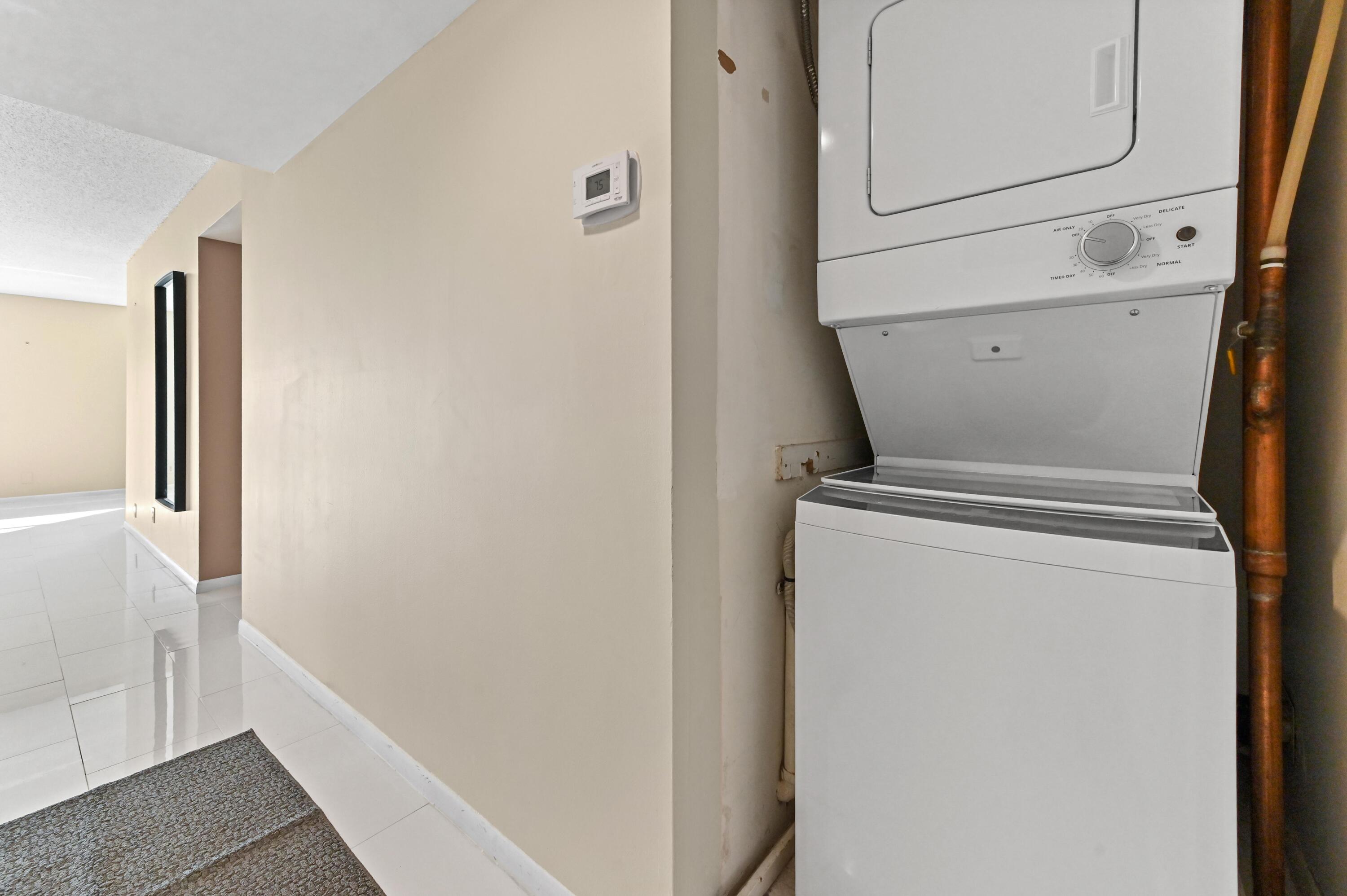 5700 Northwest 2nd Avenue, Unit 503 Boca Raton, FL 33487 - Photo 22 of 37 a utility room with dryer and washer