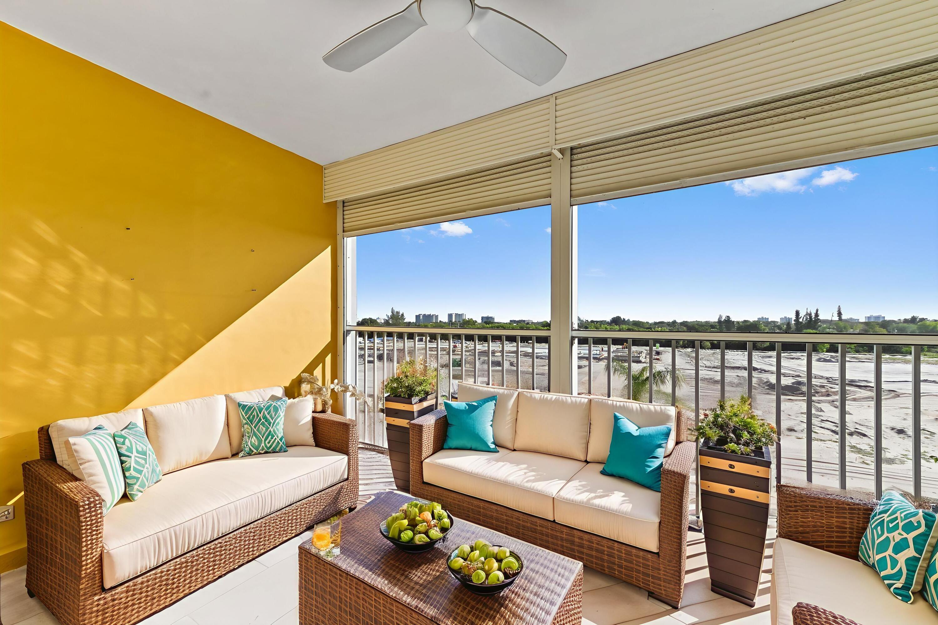 5700 Northwest 2nd Avenue, Unit 503 Boca Raton, FL 33487 - Photo 25 of 37 a roof deck with couches and city view