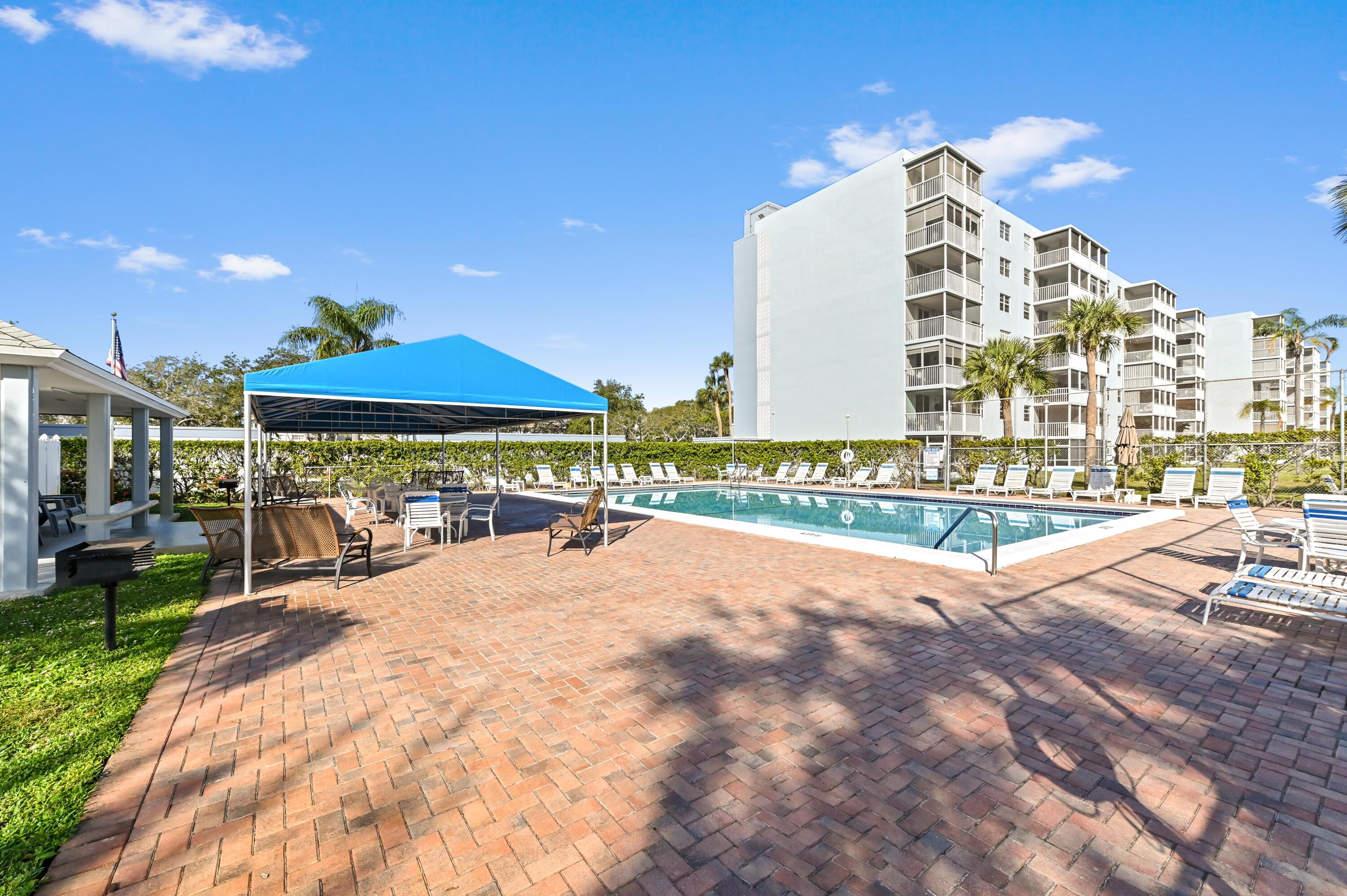 5700 Northwest 2nd Avenue, Unit 503 Boca Raton, FL 33487 - Photo 35 of 37 a view of a swimming pool with a patio