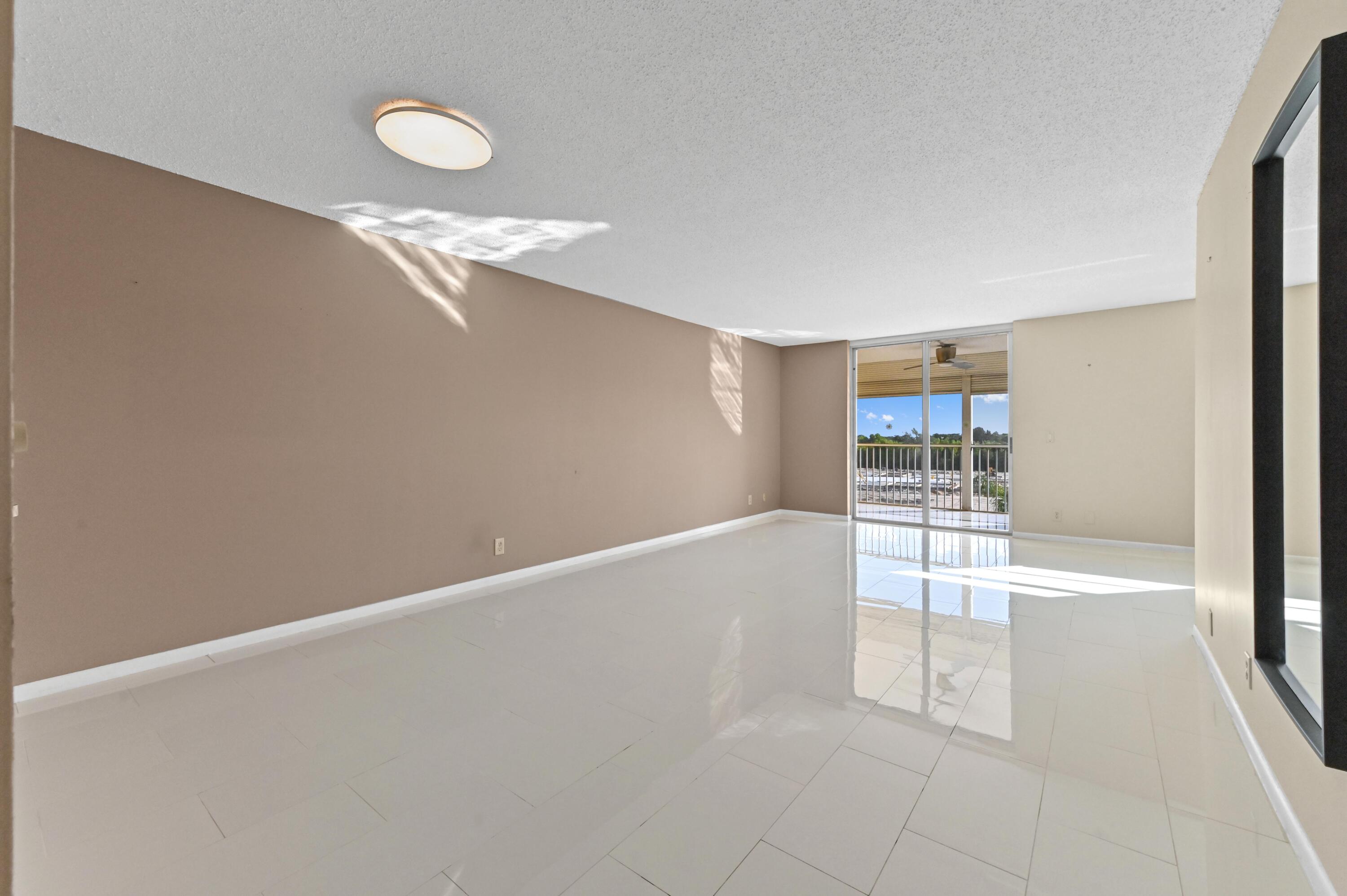 5700 Northwest 2nd Avenue, Unit 503 Boca Raton, FL 33487 - Photo 5 of 37 a view of an empty room with a window