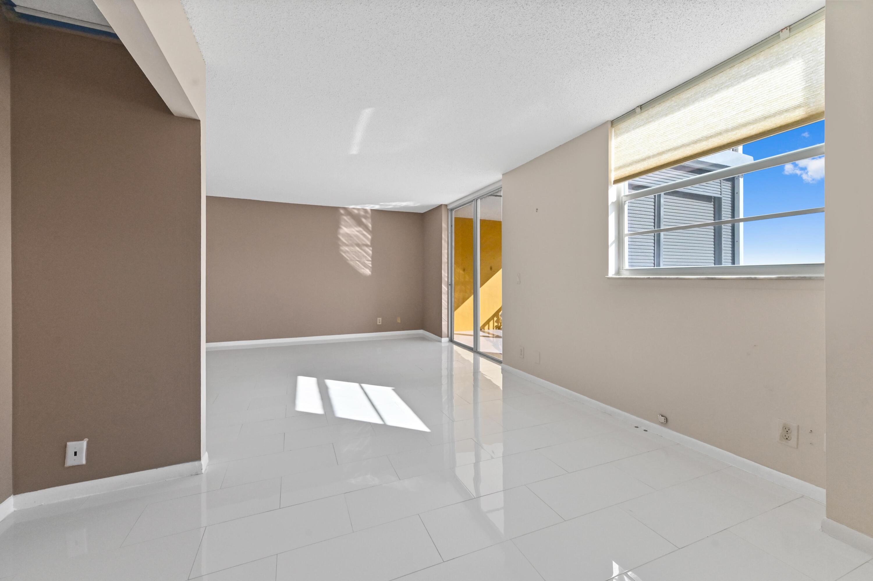 5700 Northwest 2nd Avenue, Unit 503 Boca Raton, FL 33487 - Photo 10 of 37 a view of an empty room with a window