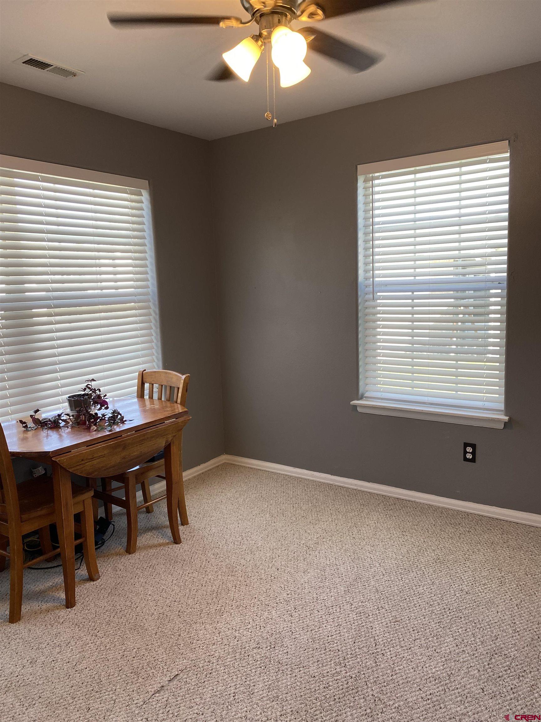 802 Riley Lane Delta, CO 81416 - Photo 14 of 16 a view of a workspace with furniture and a window