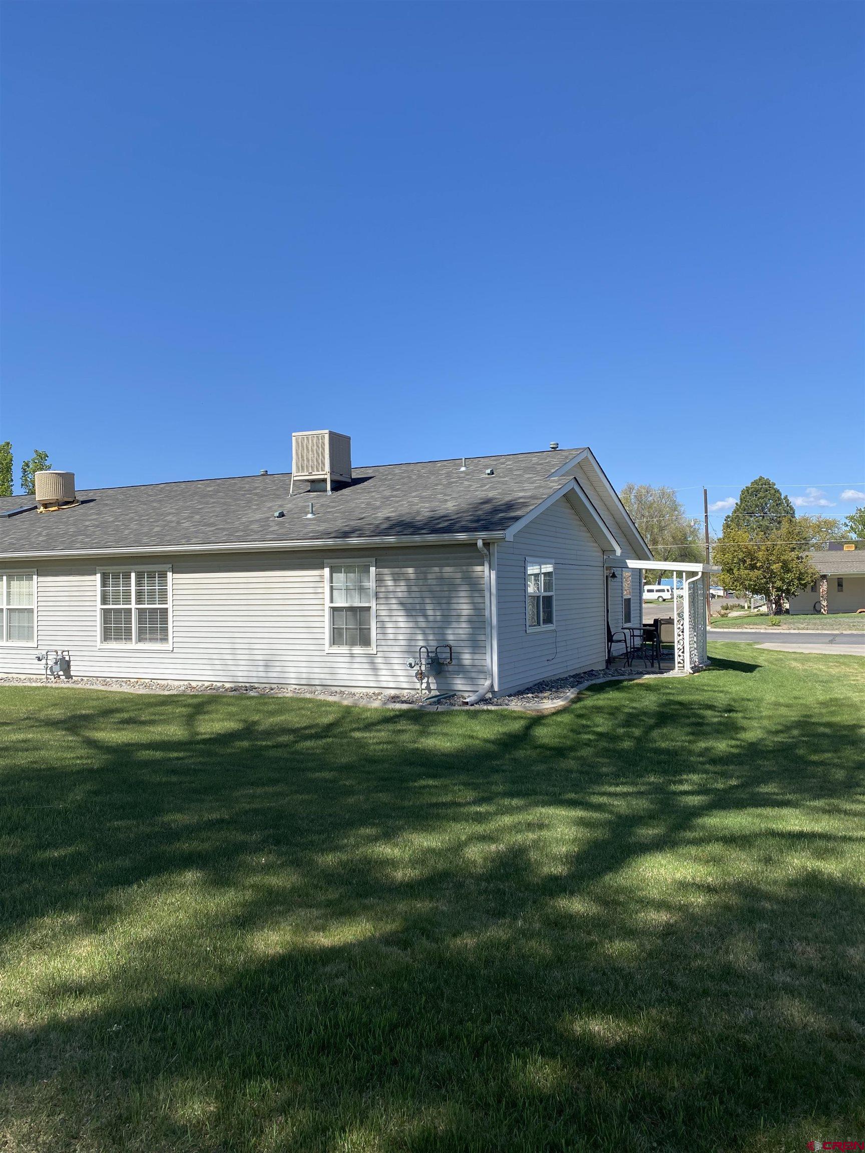 802 Riley Lane Delta, CO 81416 - Photo 2 of 16 a front view of a house with a yard