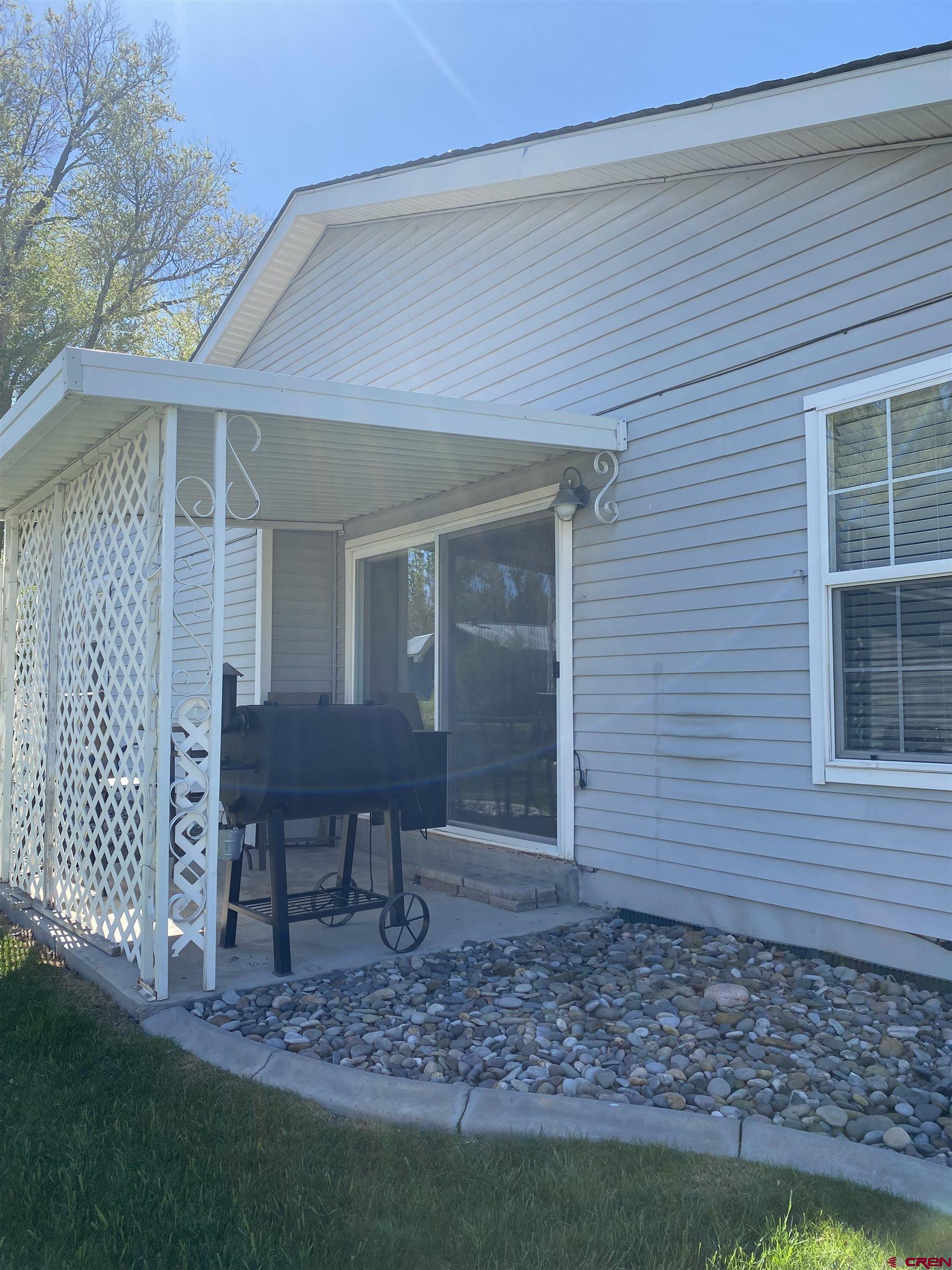802 Riley Lane Delta, CO 81416 - Photo 3 of 16 a view of a house with a yard