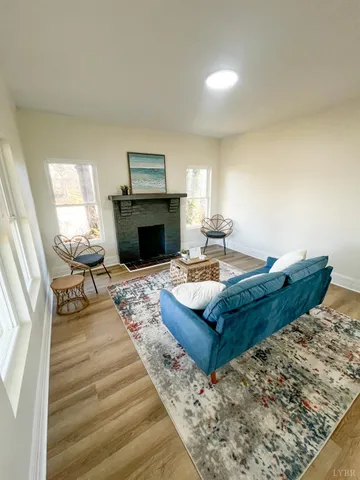 a living room with furniture and a fireplace
