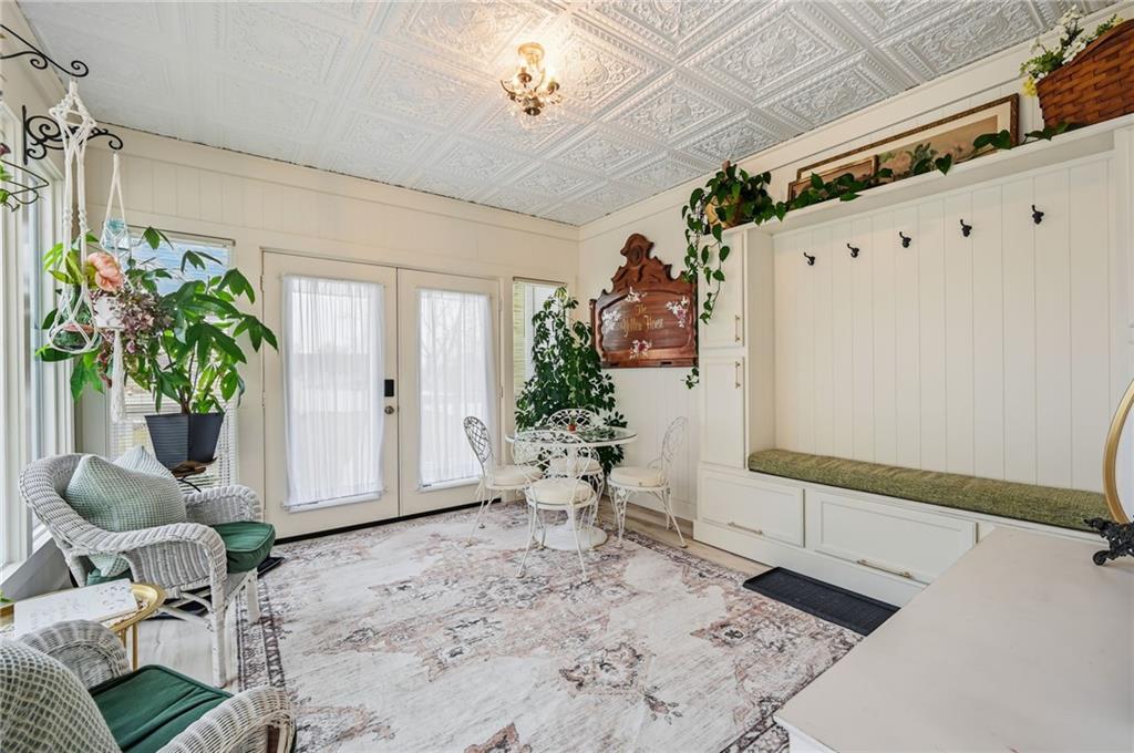 131 South Pitt Street Mercer, PA 16137 - Photo 12 of 50 a view of a hallway with wooden floor and a potted plant