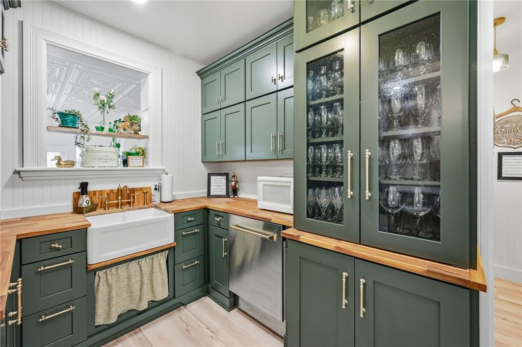 131 South Pitt Street Mercer, PA 16137 - Photo 14 of 50 a kitchen with stainless steel appliances granite countertop a refrigerator and a sink