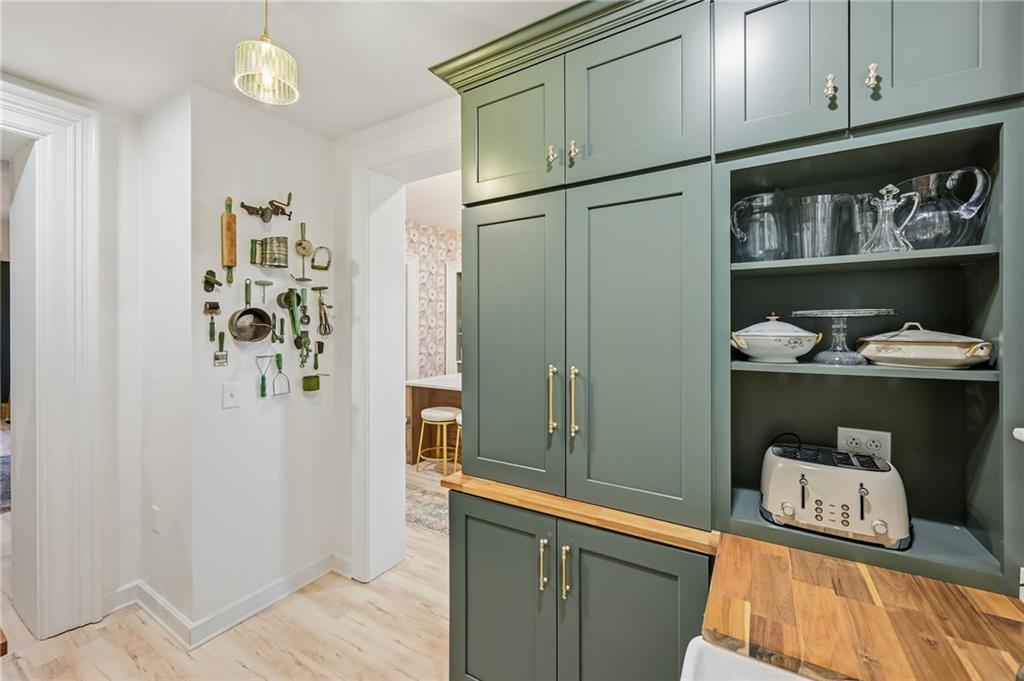 131 South Pitt Street Mercer, PA 16137 - Photo 15 of 50 a kitchen with white cabinets and refrigerator