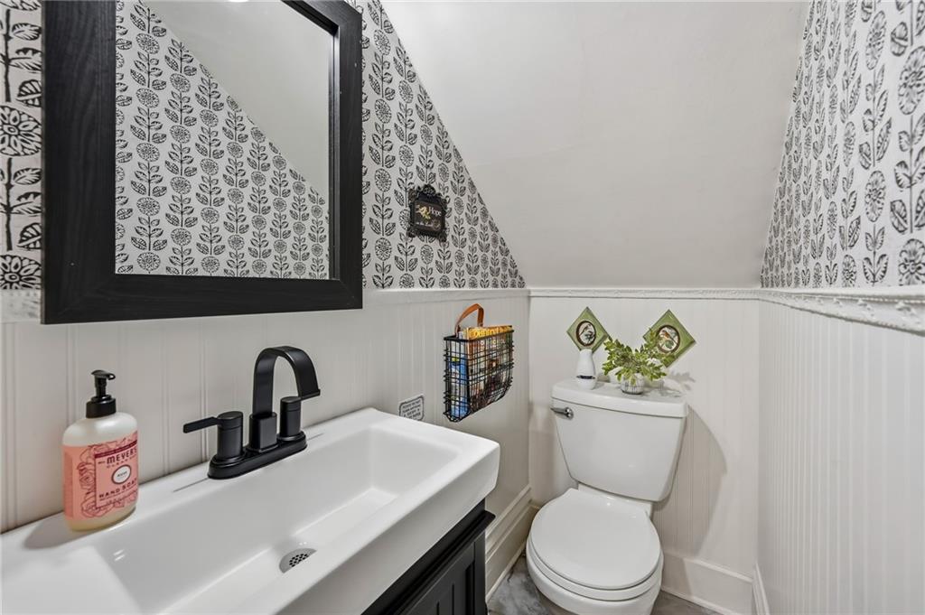 131 South Pitt Street Mercer, PA 16137 - Photo 17 of 50 a bathroom with a toilet sink and mirror