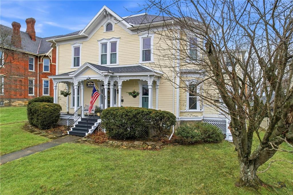 131 South Pitt Street Mercer, PA 16137 - Photo 2 of 50 a front view of a house with a garden