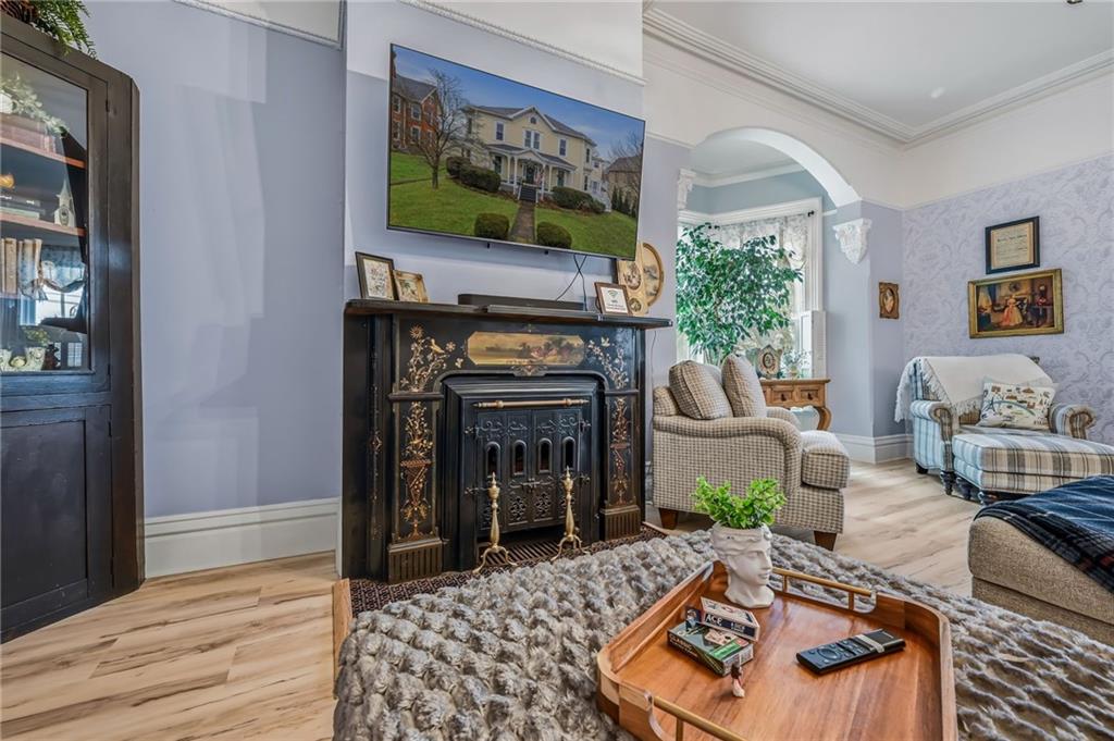 131 South Pitt Street Mercer, PA 16137 - Photo 21 of 50 a living room with furniture a flat screen tv and a fireplace
