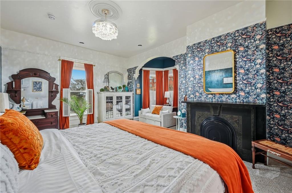 131 South Pitt Street Mercer, PA 16137 - Photo 23 of 50 a bedroom with bed and a fireplace