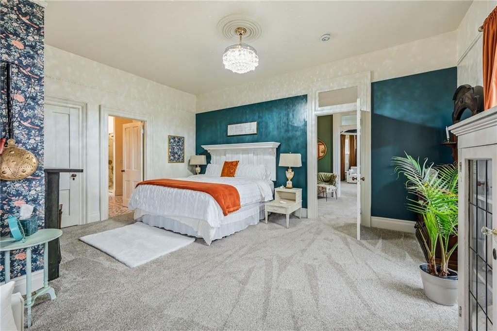 131 South Pitt Street Mercer, PA 16137 - Photo 24 of 50 a bedroom with a bed potted plant with the mirror