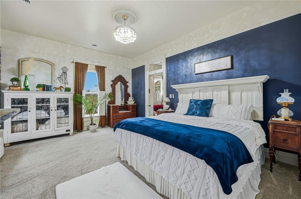 131 South Pitt Street Mercer, PA 16137 - Photo 29 of 50 a bedroom with a large bed and a dresser