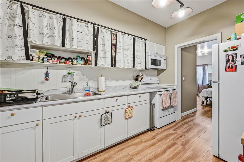 131 South Pitt Street Mercer, PA 16137 - Photo 39 of 50 a kitchen with stainless steel appliances sink cabinets and window