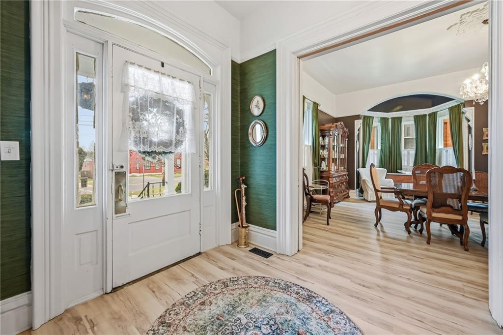 131 South Pitt Street Mercer, PA 16137 - Photo 4 of 50 a view of a livingroom kitchen and dining room with wooden floor