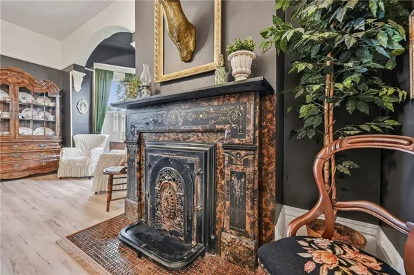 a living room with furniture a rug and a fireplace