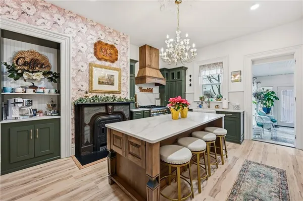 a view of a dining room with furniture and a chandelier