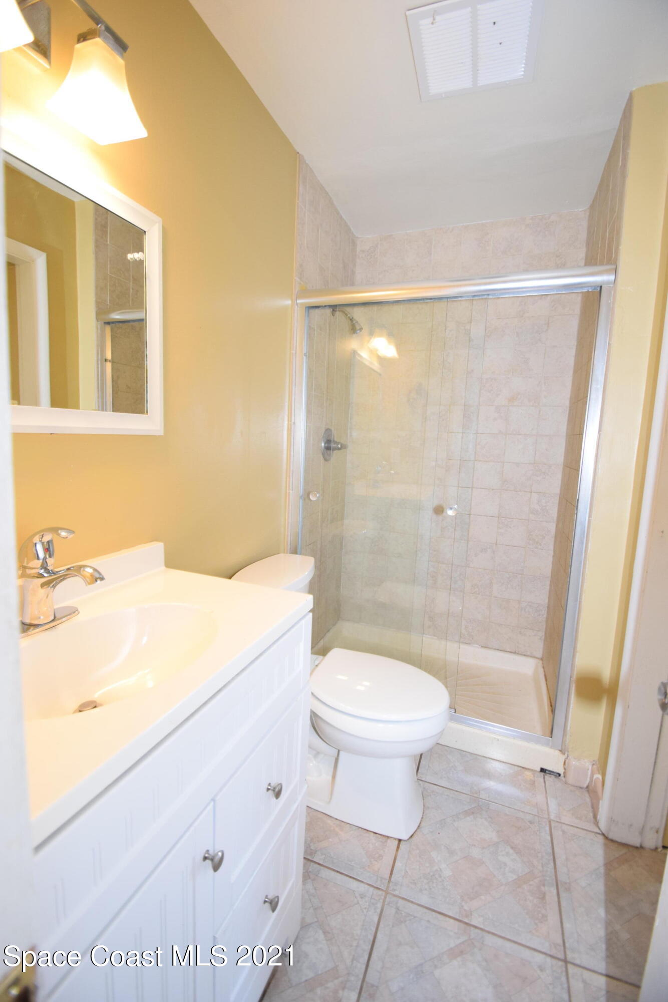 680 Aloha Avenue Cocoa, FL 32927 - Photo 24 of 27 a bathroom with a sink a toilet and shower