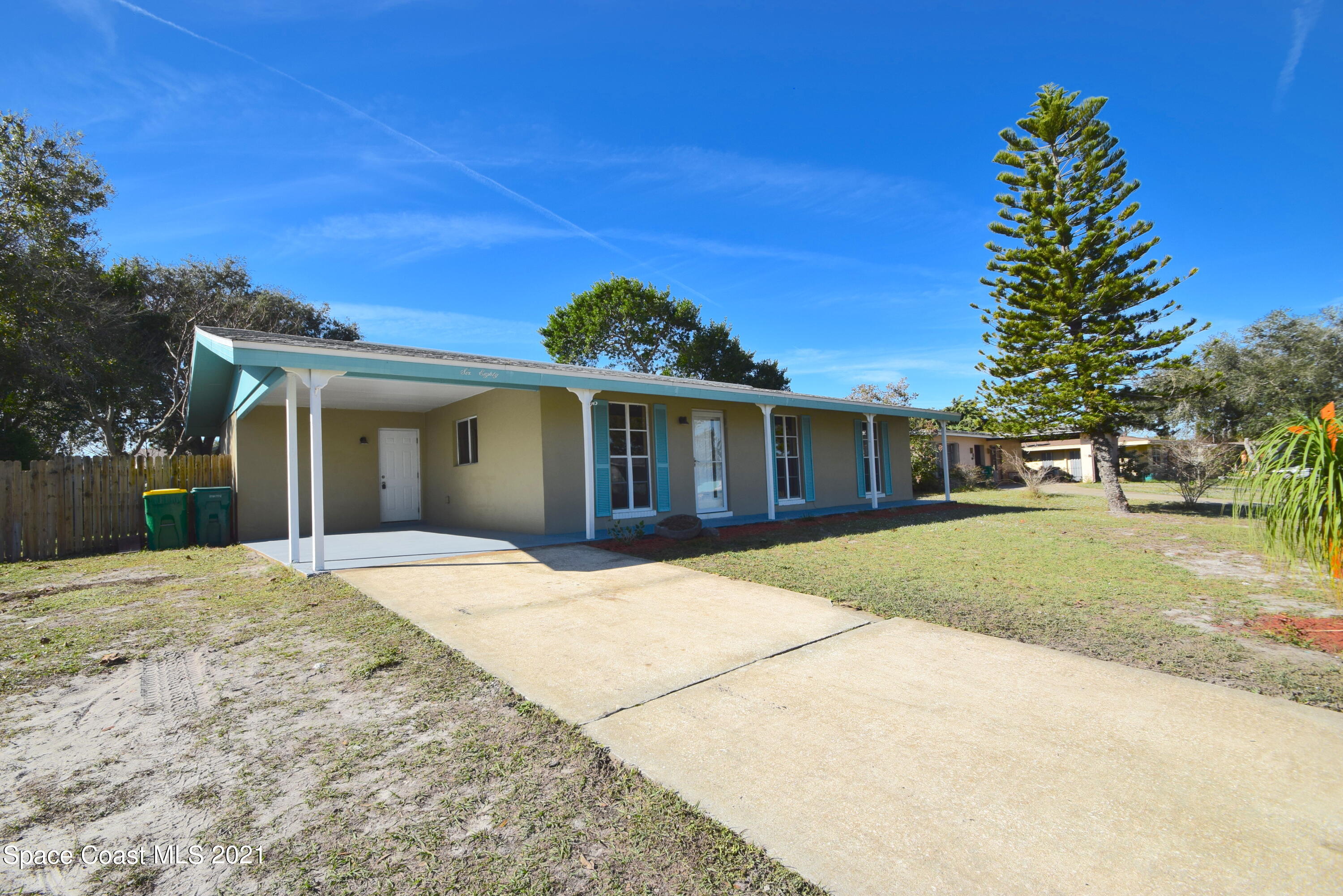 680 Aloha Avenue Cocoa, FL 32927 - Photo 3 of 27 front view of a house with a yard