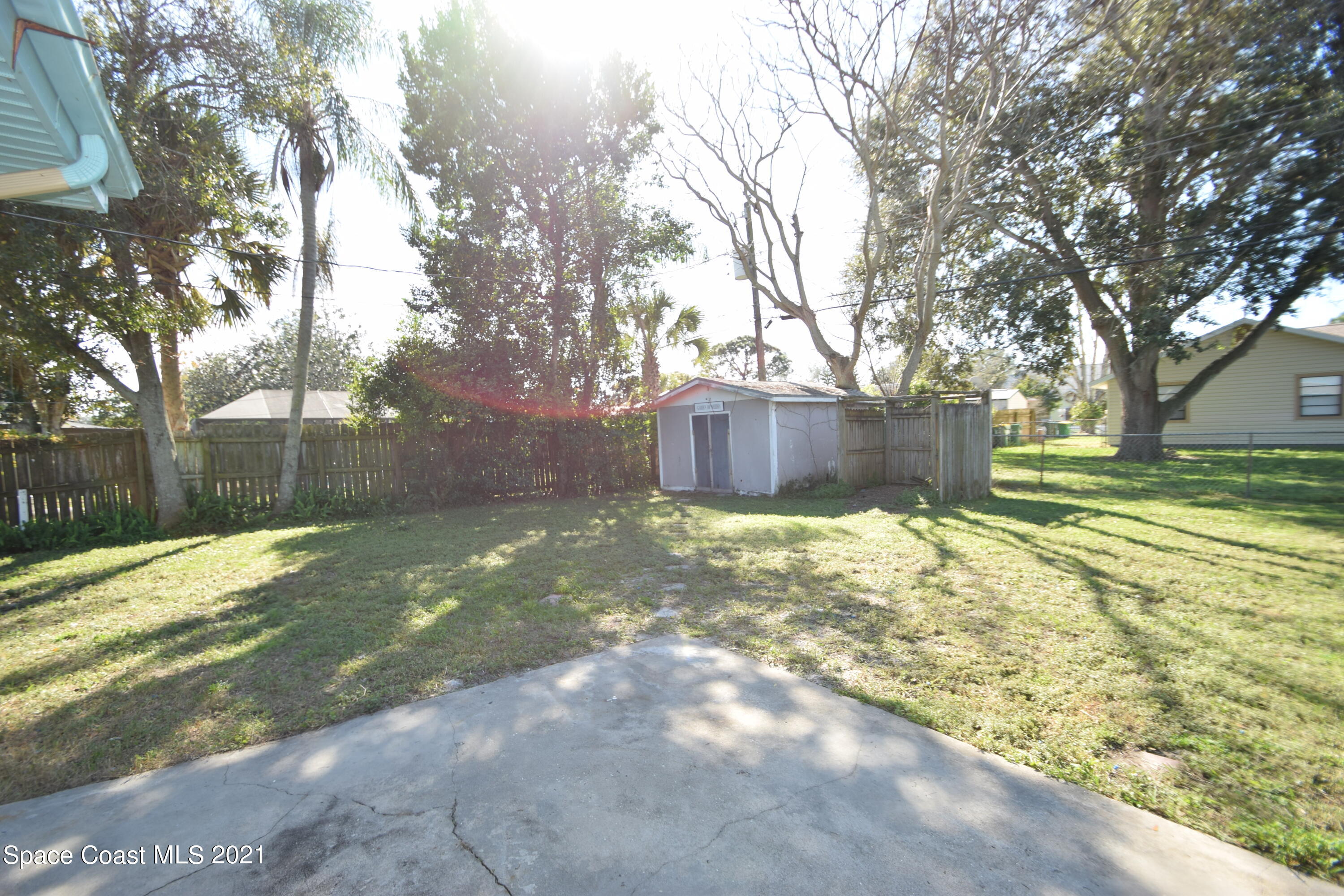 680 Aloha Avenue Cocoa, FL 32927 - Photo 5 of 27 a view of a yard with a tree