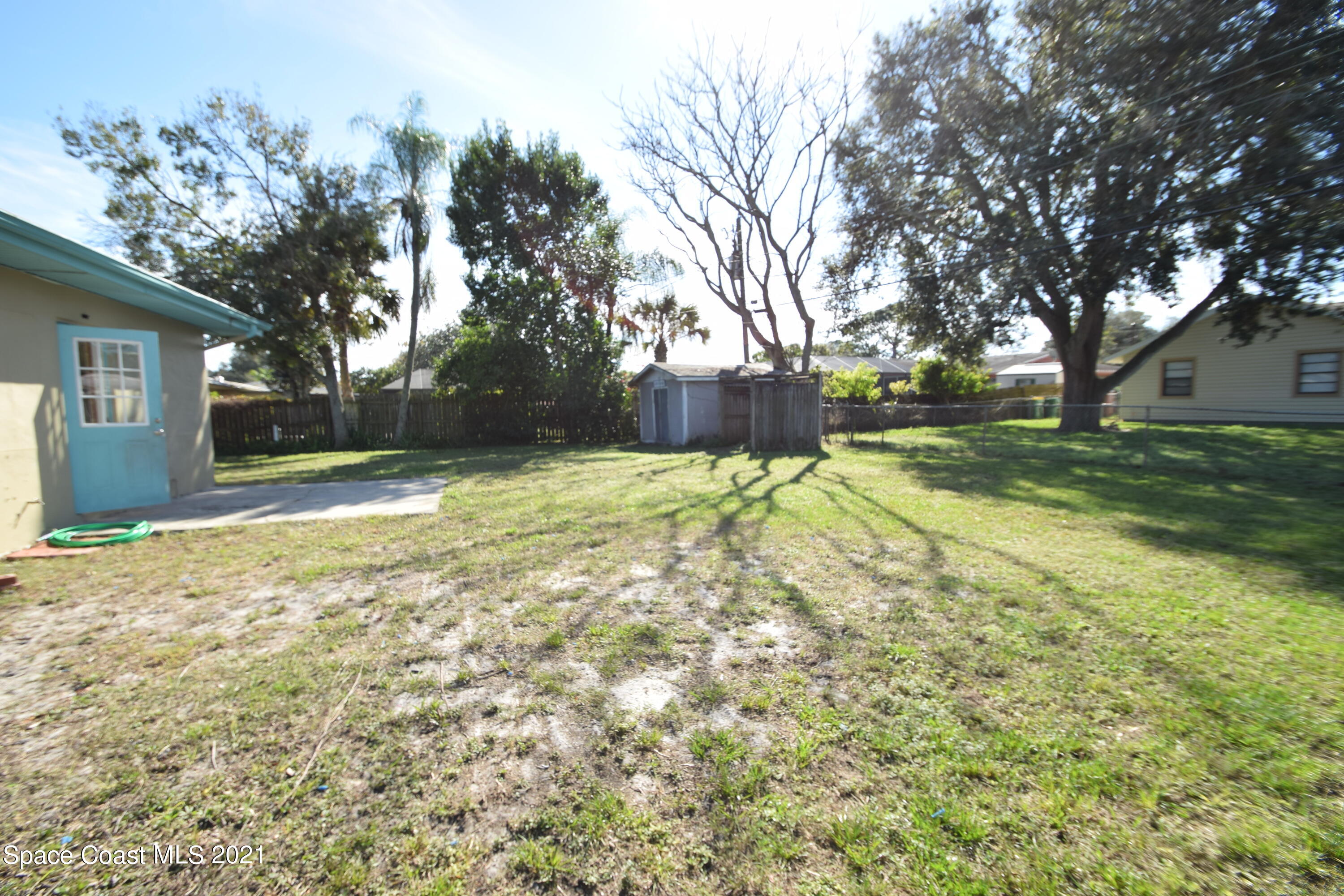 680 Aloha Avenue Cocoa, FL 32927 - Photo 6 of 27 a view of a yard with a house and large trees