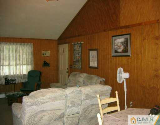 3 Kenmore Road Edison, NJ 08817 - Photo 3 of 8 a bedroom with a bed and dresser