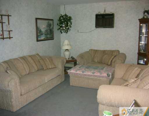 3 Kenmore Road Edison, NJ 08817 - Photo 4 of 8 a living room with furniture and a couch