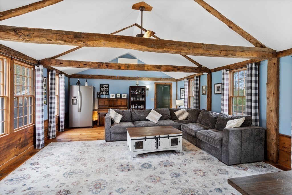 85 Forest Street Dunstable, MA 01827 - Photo 13 of 42 a living room with furniture and a floor to ceiling window