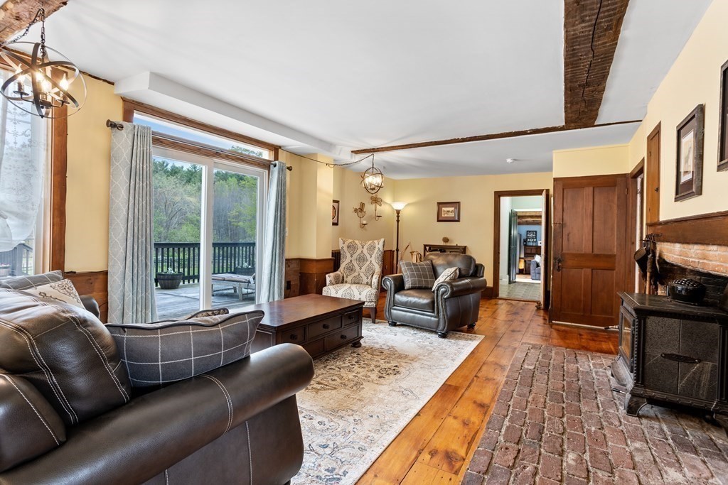 85 Forest Street Dunstable, MA 01827 - Photo 16 of 42 a living room with furniture fireplace and a large window