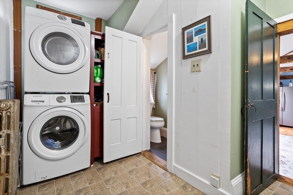 85 Forest Street Dunstable, MA 01827 - Photo 17 of 42 a view of a hallway with washer and dryer