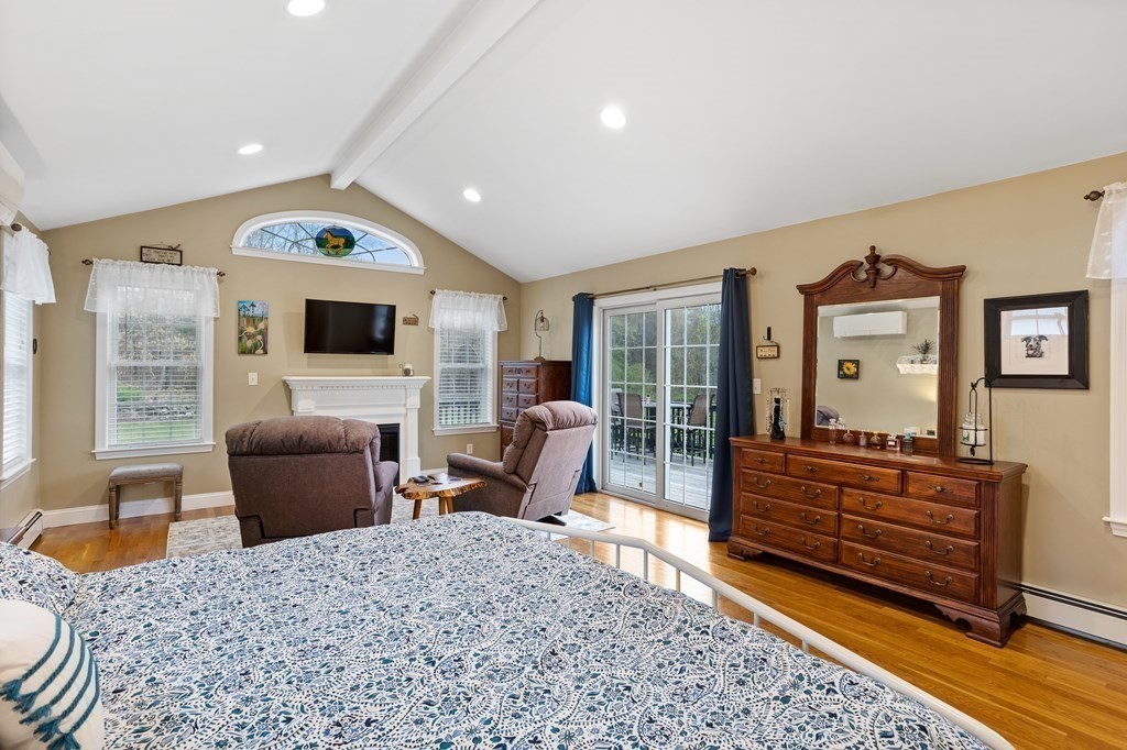 85 Forest Street Dunstable, MA 01827 - Photo 21 of 42 a living room with furniture and a fireplace