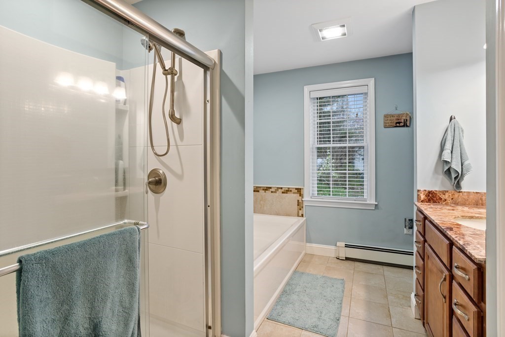 85 Forest Street Dunstable, MA 01827 - Photo 22 of 42 a bathroom with a tub sink and mirror