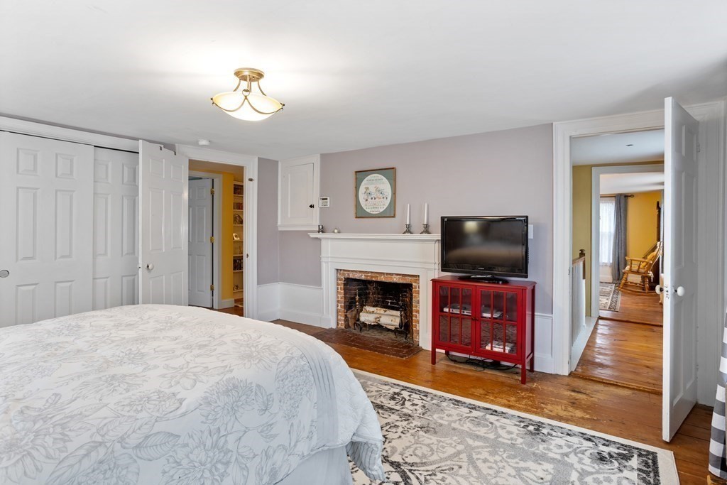 85 Forest Street Dunstable, MA 01827 - Photo 25 of 42 a bedroom with a bed and a flat screen tv
