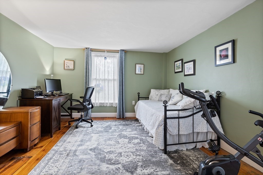 85 Forest Street Dunstable, MA 01827 - Photo 30 of 42 a livingroom with workspace and a couch