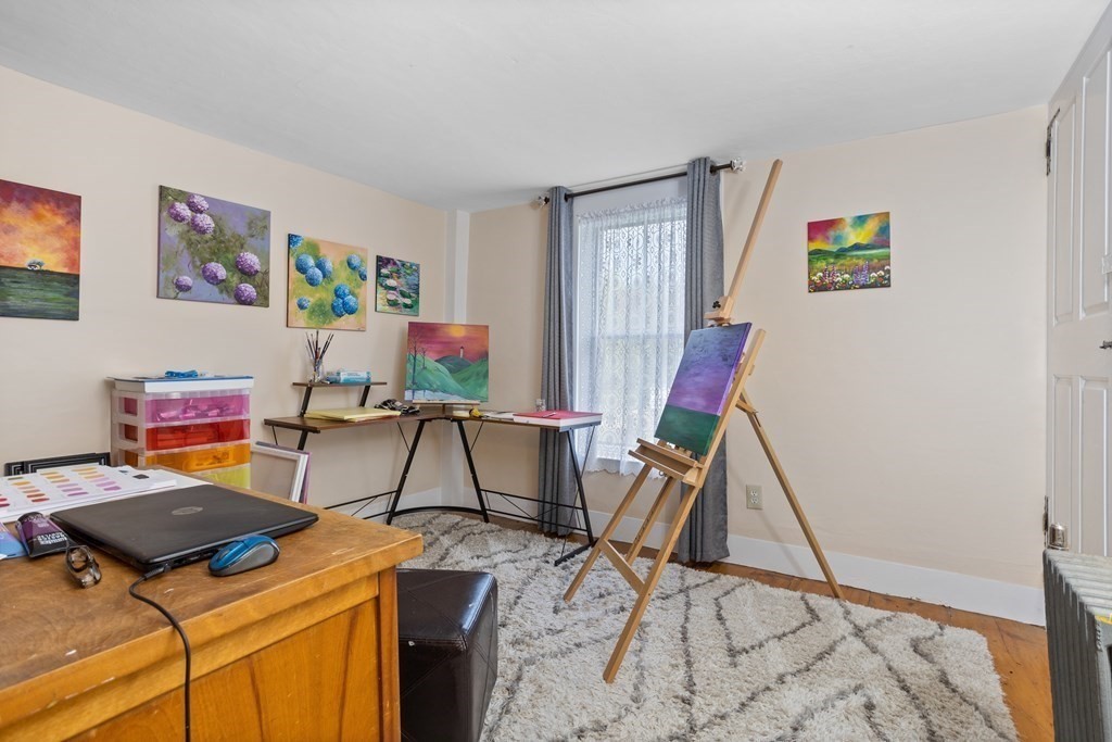 85 Forest Street Dunstable, MA 01827 - Photo 31 of 42 a room with furniture and a flat screen tv