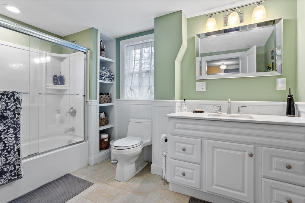 85 Forest Street Dunstable, MA 01827 - Photo 32 of 42 a bathroom with a toilet sink and mirror