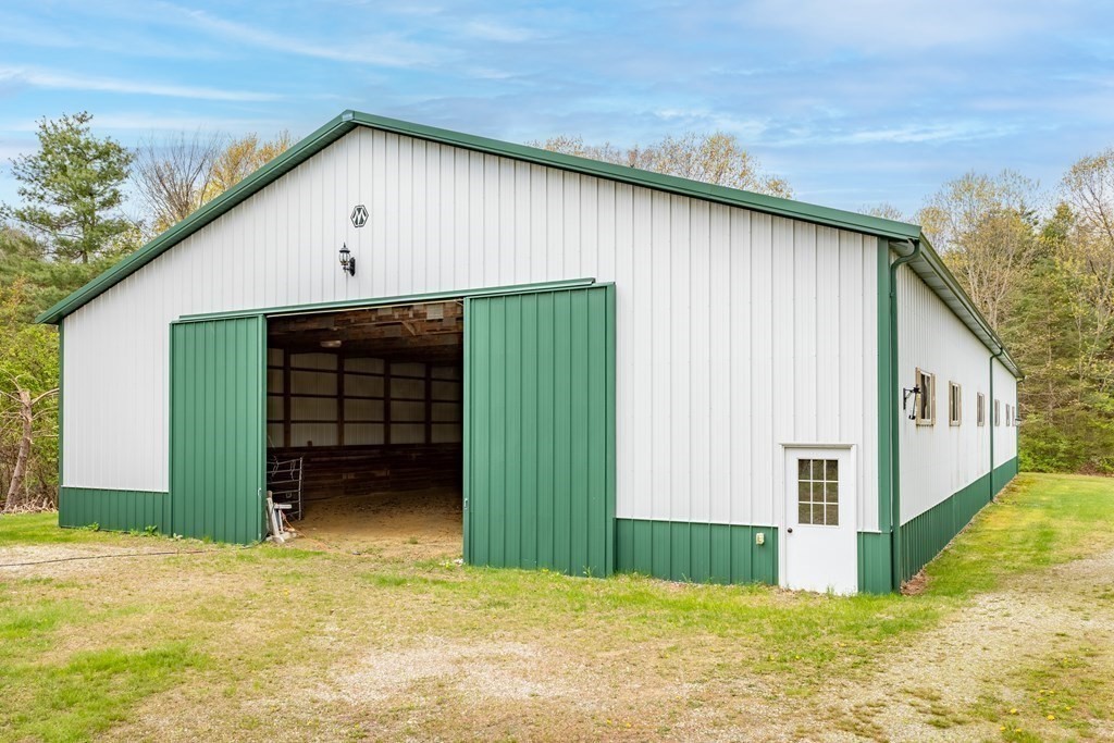 85 Forest Street Dunstable, MA 01827 - Photo 4 of 42 a view of a house with a outdoor space