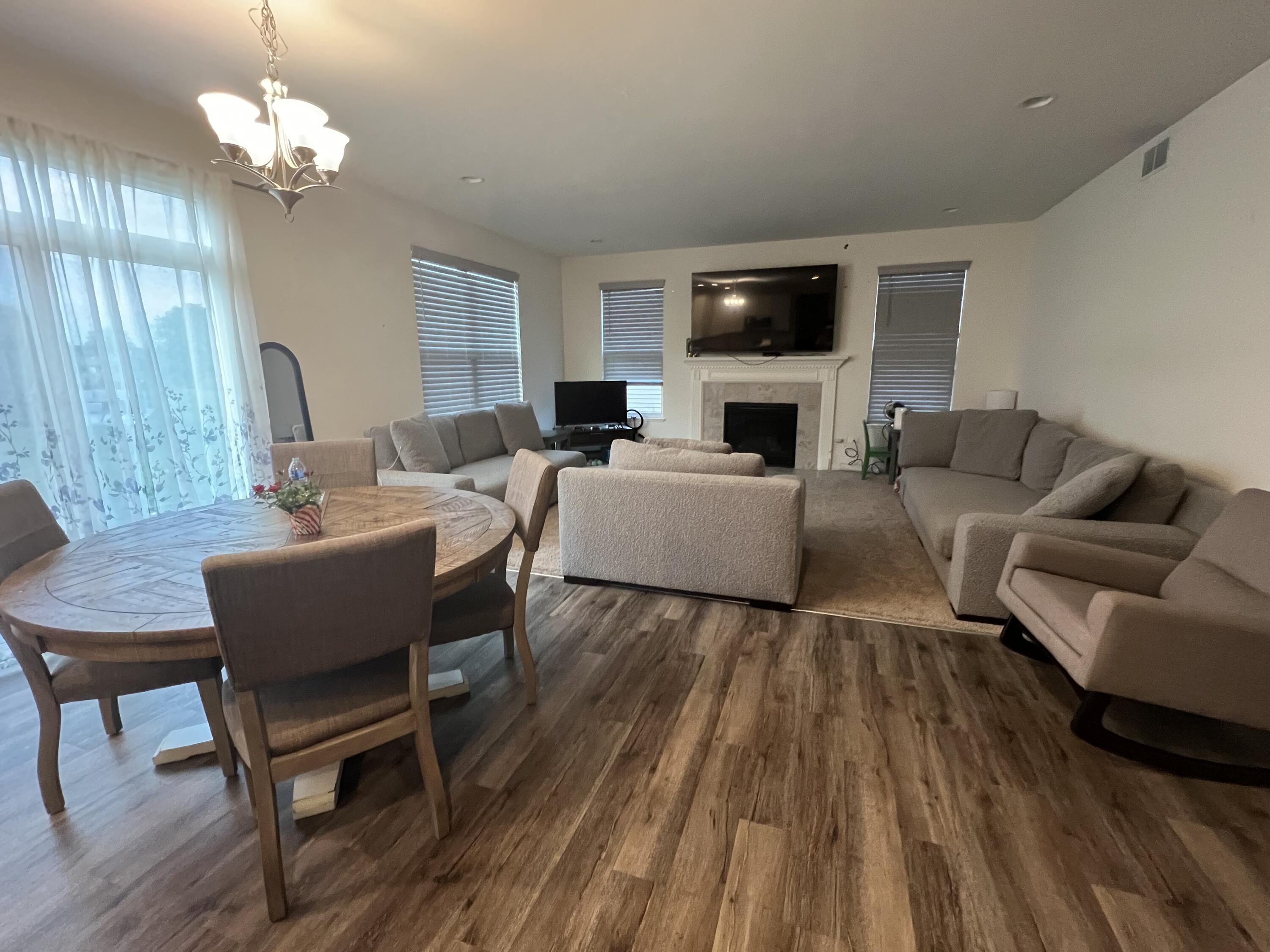 10193 California Street Crown Point, IN 46307 - Photo 13 of 33 a living room with furniture a fireplace and a flat screen tv