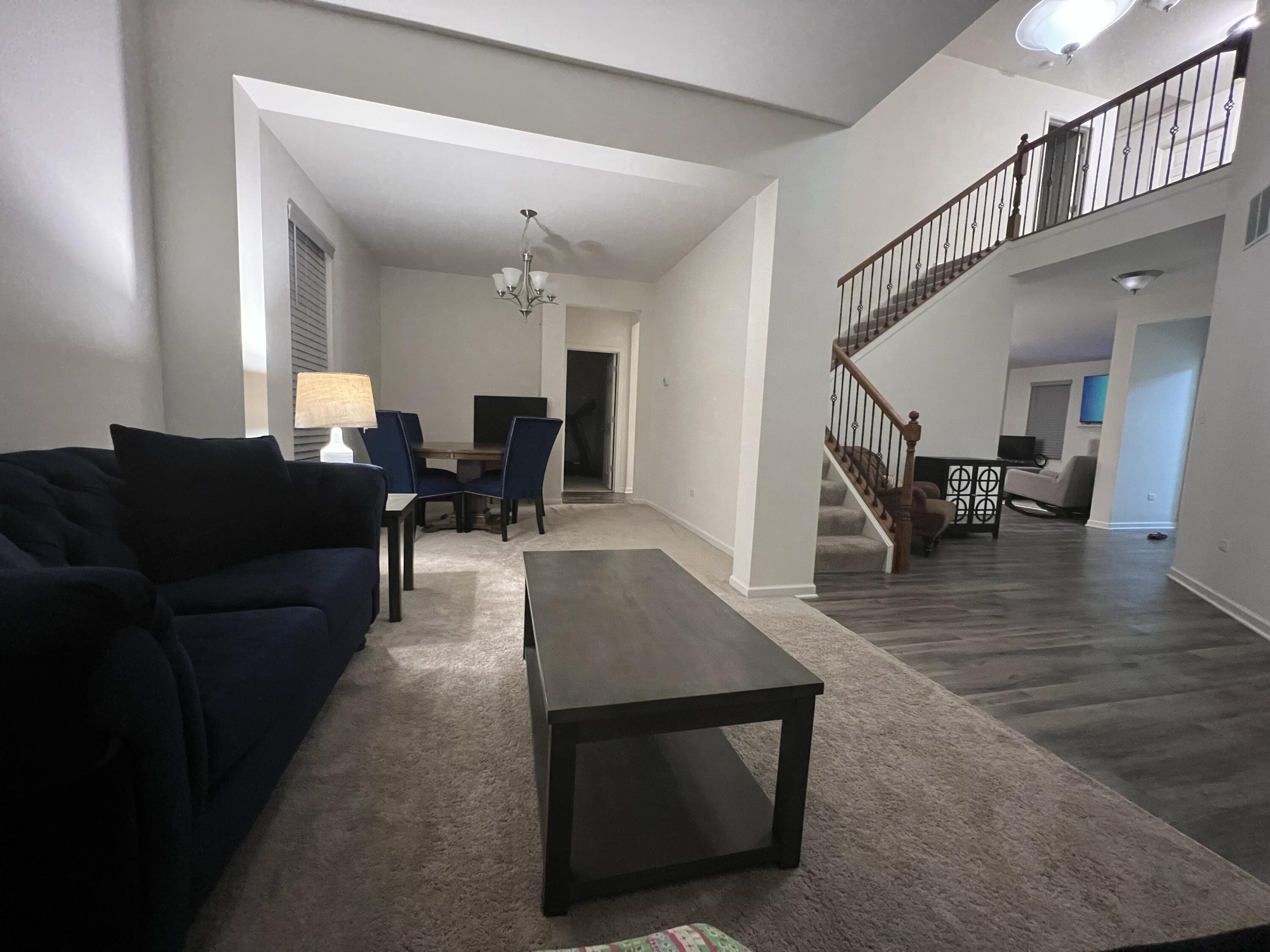 10193 California Street Crown Point, IN 46307 - Photo 22 of 33 a living room with furniture and a dining table