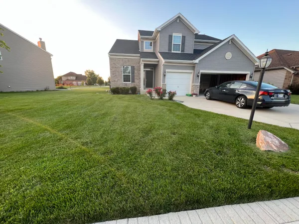 a front view of house with an outdoor space and seating